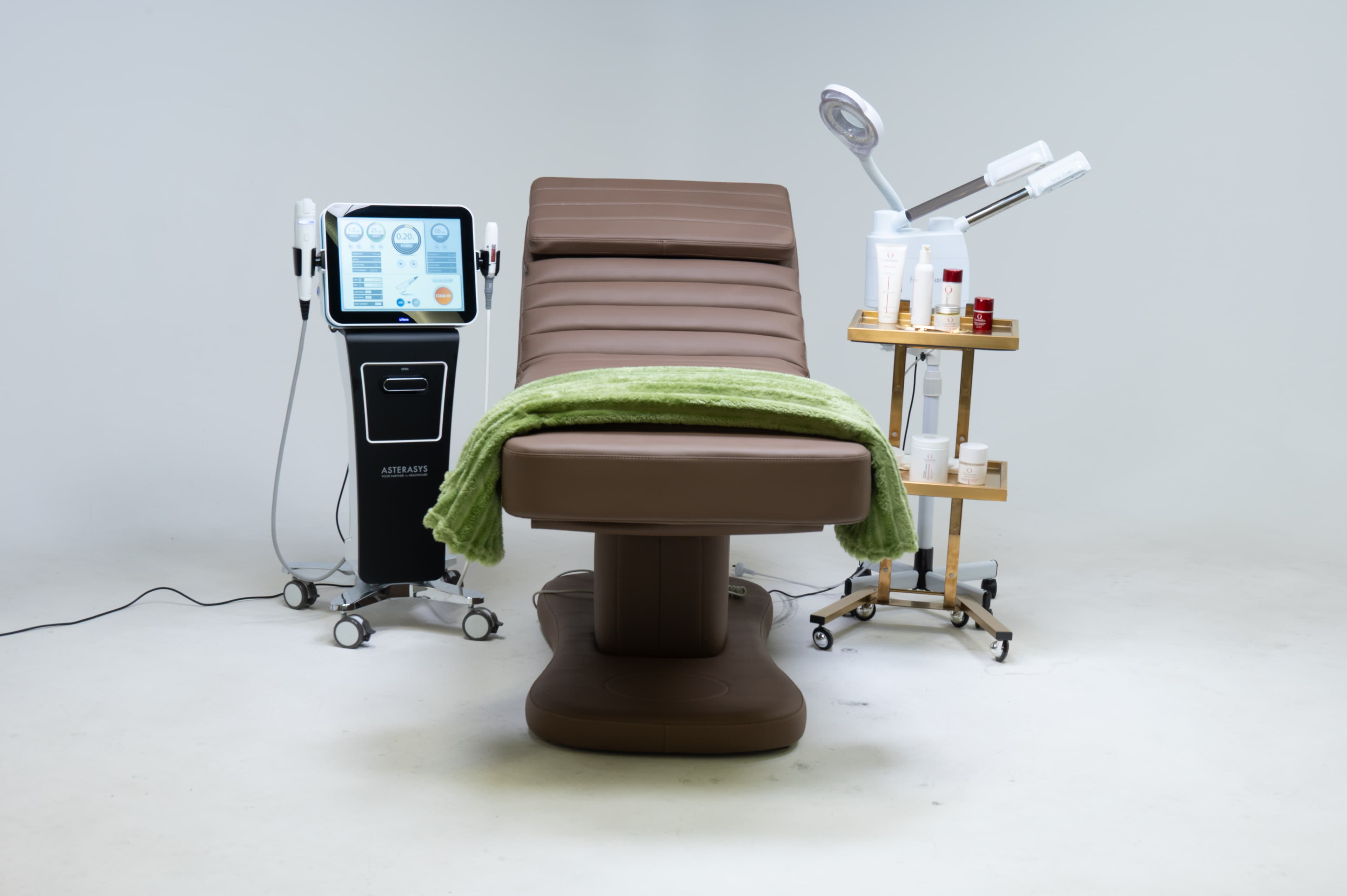 Treatment bed with professional equipment in the creative studio
